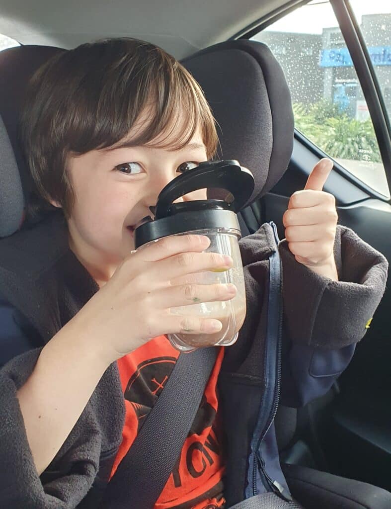 child drinking healthy smoothie to keep away winter bugs
